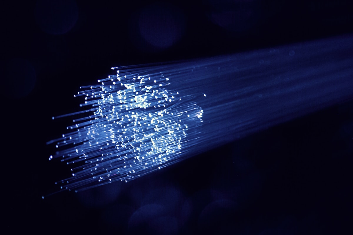 Illuminated fibre-optic strands carrying broadband data